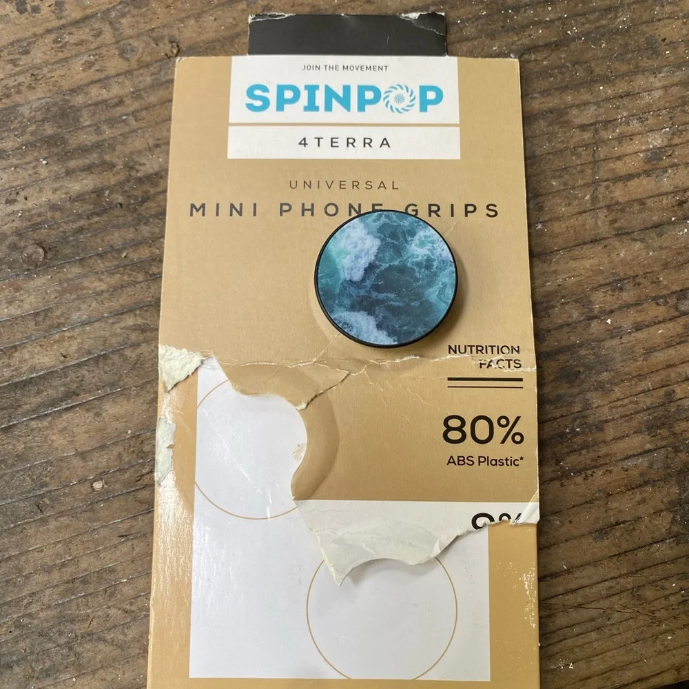 One New in Package Spinpop 4Terra Stick-On Universal Mini Phone Grip